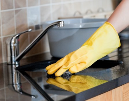 Professional cleaners performing end of tenancy cleaning in a Surrey home